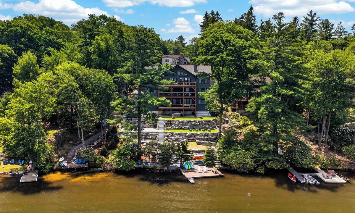 Lake Harmony Estates Ski Chalet | An Elevated Group Retreat with Soaring Glass, Lake Views, Boats, 3 Decks