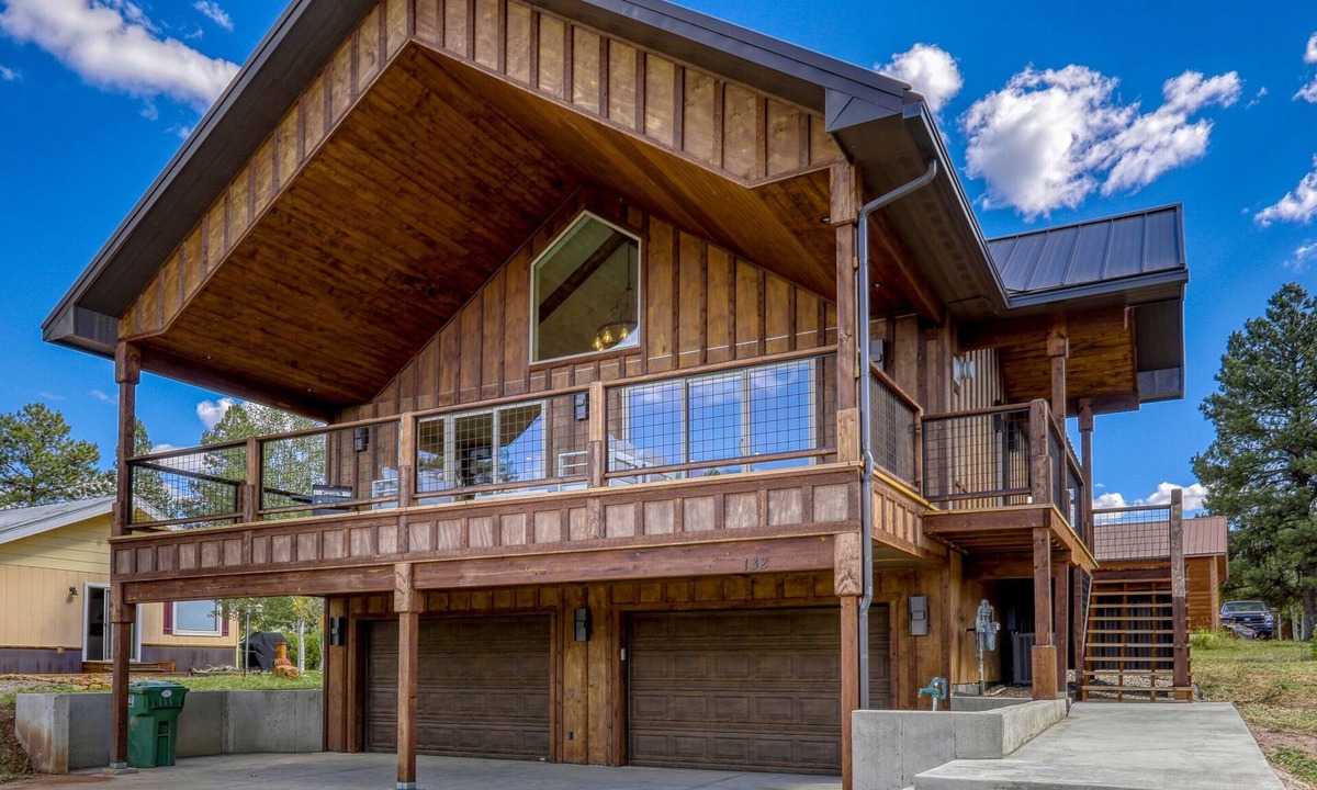 Pagosa Springs House | Cloud Cap Lake Home — a modern 3-bed, 2-bath retreat with a covered deck over serene lake views. Paddleboards, bikes, helmets & life jackets included.