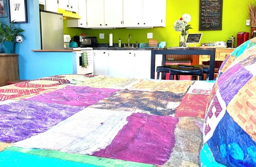University Park Apartment | Boutique Studio Apartment Hotel across from CSU in Old Town Fort Collins!Take a trip back in time to when Hippies, Coffee Houses, and The British Invasion were everywhere! It's an urban-industrial studio, a rustic garden suite, and our pet-friendly c