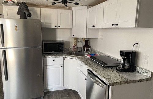 Centennial House | Bright Walk-Out 2BR · Private Patio & Yard · Quiet Area