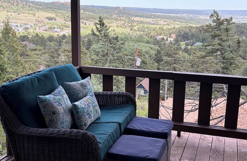 Palmer Lake House | Built in 1908 this historic cabin is full of original charm with a penthouse view. Step inside and you are immediately greeted by a full unobstructed view of Elephant Rock. Sleeping up to 9 people.
