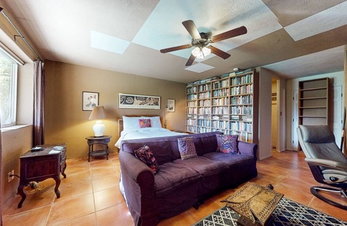 Taos House | Charming secluded home mountain views, covered front porch, & book collection