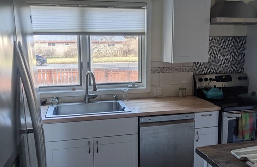 Gunnison House | Cheerful 3 bedroom in convenient location with a hot tub, sunroom and big yard.