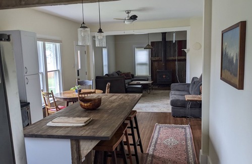 Gunnison House | Cheerful 3 bedroom in convenient location with a hot tub, sunroom and big yard.