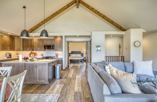 Pagosa Springs House | Cloud Cap Lake Home — a modern 3-bed, 2-bath retreat with a covered deck over serene lake views. Paddleboards, bikes, helmets & life jackets included.