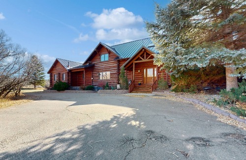 Glenwood Springs Cabin | Dog-friendly, mountain view lodge with a game room, fireplace, large deck, & W/D
