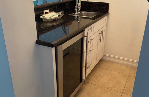 Wilton Manors House | Eco-friendly 100% solar home with 42 ft salt water, lap pool/spa on new river