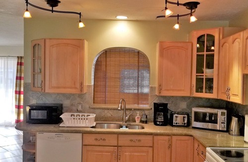 Garden Isles House | Family Waterfront Retreat – Private Pool, Hot Tub, Walk to Beach!