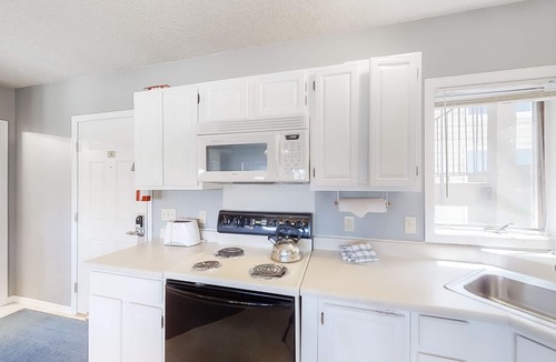 Silvercreek Condo | Inviting condo with outdoor heated pool, private hot tub, fireplace & W/D access