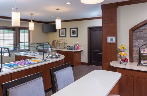 North Canton Condo | King Suite. Free Breakfast Buffet. Pool & Hot Tub Access.