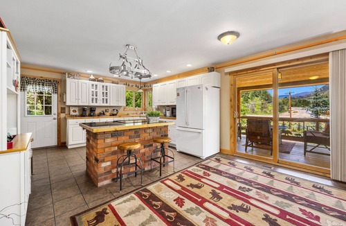 Drake Cabin | Luxury Riverfront Cabin Near RMNP with Hot Tub, Fire Pit, and Mountain Views