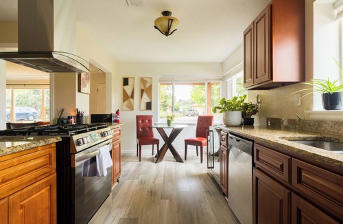 Lakewood House | Mid-century brick ranch house, centrally located, with Hot tub