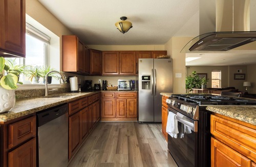 Lakewood House | Mid-century brick ranch house, centrally located, with Hot tub