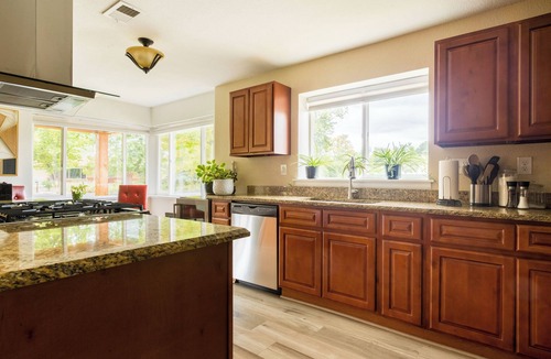 Lakewood House | Mid-century brick ranch house, centrally located, with Hot tub