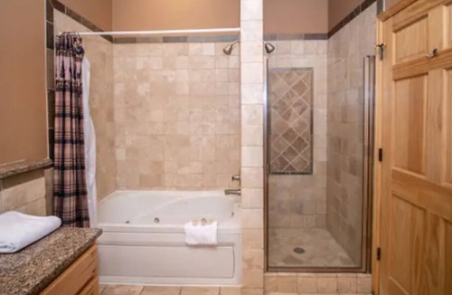 Stanley Hills Condo | Modern log-cabin style condo, fireplace, patio, hot tub, perfect retreat! #301