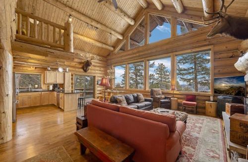 Estes Park House | Mounticello Log Cabin - Relaxing Front Patio & Outdoor Firepit