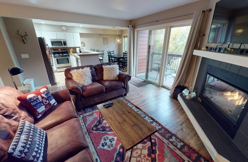 Mountain House Condo | On River Trail, 2 Hot Tubs! Ground Floor. Walk to Festivals, Dining, Shops