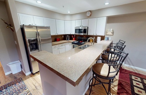 Mountain House Condo | On River Trail, 2 Hot Tubs! Ground Floor. Walk to Festivals, Dining, Shops