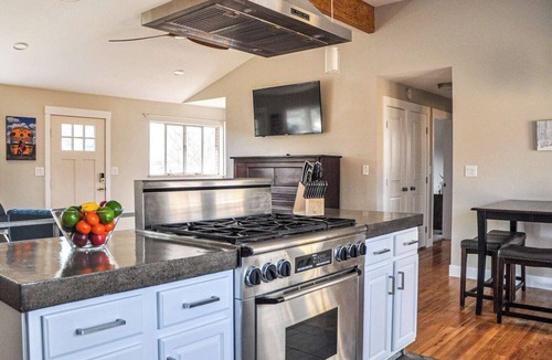 Martin Acres House | Our comfortable home, with great view of the Flatiron Mountains, sits in the heart of South Boulder. Enjoy the private hot tub spa, media room with 84" Theater TV, well stocked Chef's kitchen. Walk to shopping, restaurants, brewery and trails nearby.