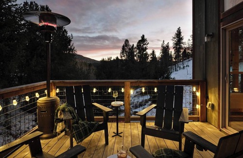 Rainbow Valley Cabin | Peaceful mountain retreat in Divide, Colorado with stunning Pikes Peak views. This 3BR cabin features a private hot tub, wellness casita for yoga or meditation, fully equipped kitchen, cozy living spaces, and easy access to hiking, nature, and quiet