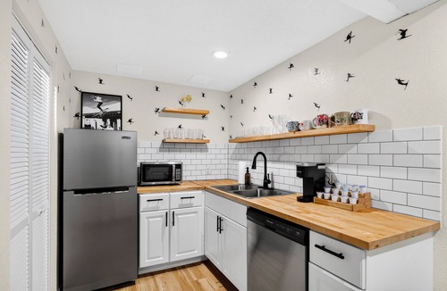 Lamar Heights Area House | Retro Modern Family Hub - perfect for large groups! Hot Tub, Game Room, Theater