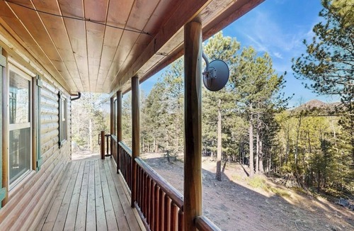 Florissant Cabin | Rural Wood Cabin Surrounded by Trees with WiFi, W/D, & Gorgeous Deck