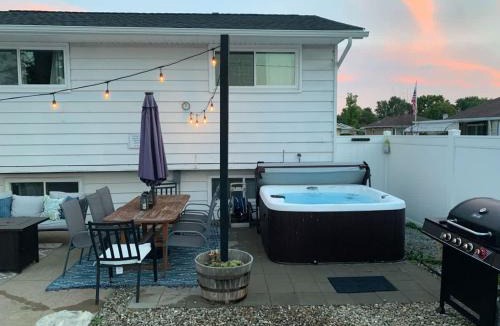 Parma House | Swim and Relax with a Pool Hot Tub and Renovated HomeHop