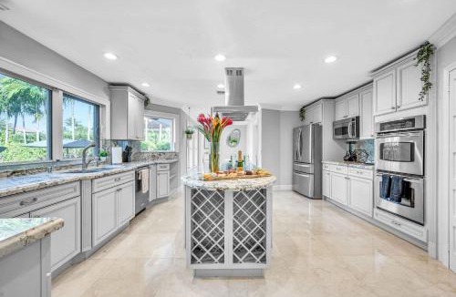 Seven Isles House | Waterfront Villa Walk to Beach Venice of America Coastal Extravagance Palm Key VlLLAS