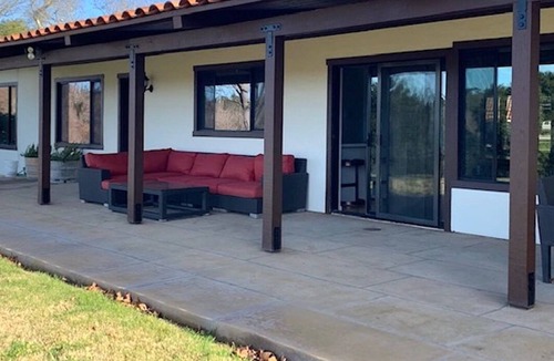 Solvang House | Wine Country Modern Ranch House on a tree lined pond.