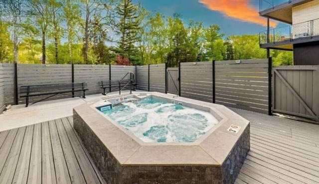 Brand new property with hot tub, fire pit, parking, covered ski storage, and more!