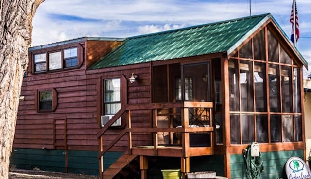 Cabin with one queen bed, two lofted twin-size beds and a queen pull out couch Sleeps: 6 Pets: 2 Parking: 1