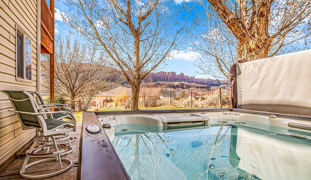 Dog-friendly, mountain view home with private hot tub, central AC, and fireplace