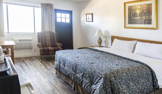 Quaint Single King Hotel Room overlooking the Gunnison River and your Private Patio! Perfect for fishing and exploring the outdoors.
