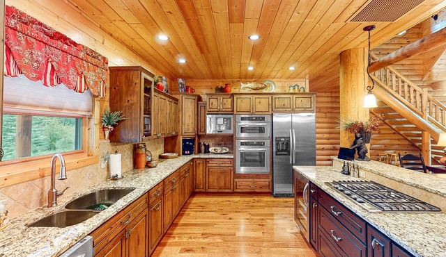 Reids River Retreat | Waterside cabin in Almont with deck, grill, & river access