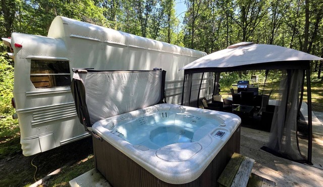 Rustic Converted School Bus with Outdoor Shower Near ORV Trails in Manistee National Forest, Michigan