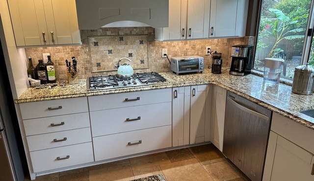 Spacious upscale four bedroom home with gourmet kitchen, Den, and game loft.