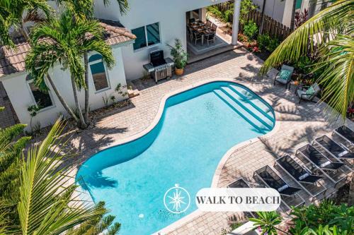 Steps from the Beach Heated Pool Sun Key Game room RESlDENCES