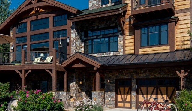 Stunning Lake Views with private boathouse deck, hot tub and close to town