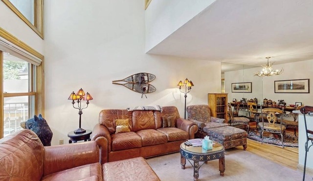 Stunning ski-in/out condo with balcony, fireplace, hot tub, & mountain views